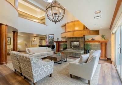 Bright common area with comfortable seating and a fireplace