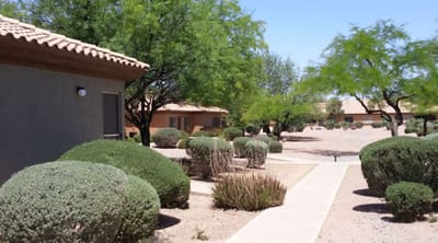 Outdoor view of landscaped grounds at a senior facility