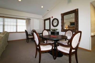 Brightly lit interior apartment space with seating