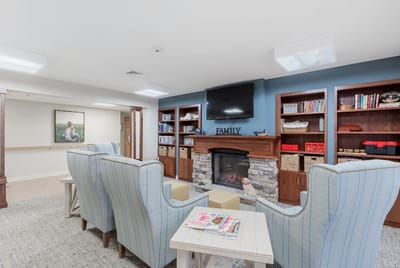 Cozy common area with comfortable seating and bookshelves
