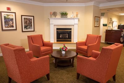 Common area with seating and fireplace