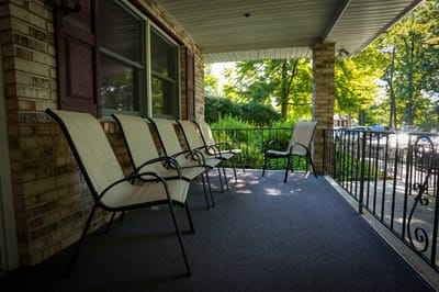 Outdoor seating area with chairs on a porch