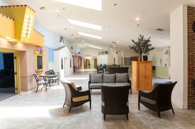 Bright common area with seating and decorative walls