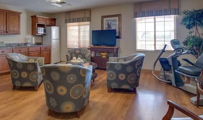 Bright common area with seating and entertainment options