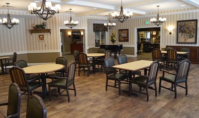 Interior view of a dining area with tables and chairs