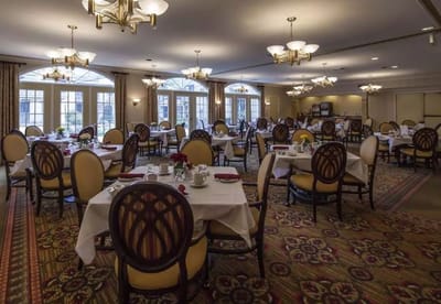 Dining room setup with tables and chairs