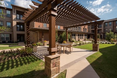 Outdoor patio area with seating and landscaping