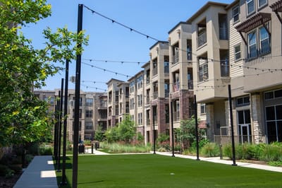 Exterior view of a senior living facility with landscaped grounds