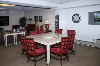 A cozy common area with a table and chairs