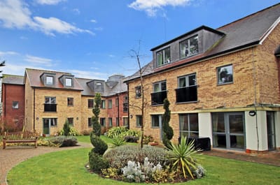 Exterior view of Westonia Court with gardens