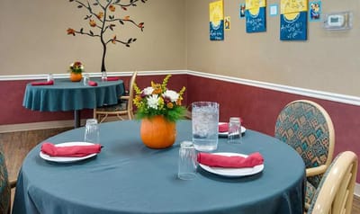 Dining room with tables set for a meal