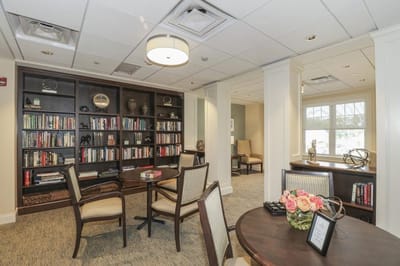 Interior view of a common area with bookshelves and seating