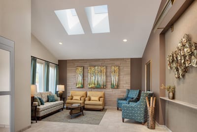 Welcoming lounge area with comfortable seating and artwork