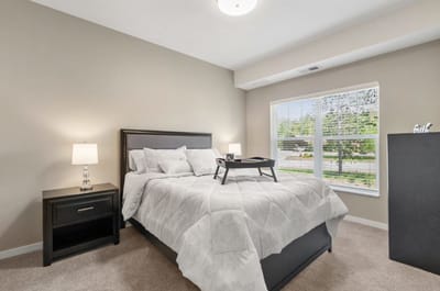 Cozy private resident room with a bed and desk