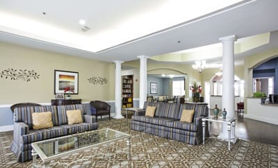 Interior lounge area with seating and bookshelves