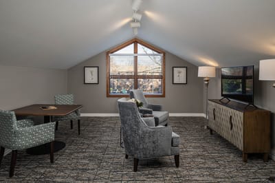 Cozy common area with seating and a TV