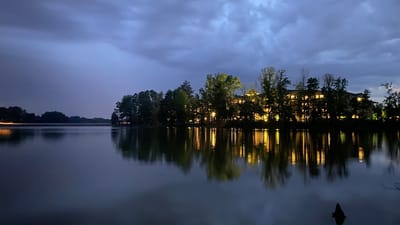 Evening view of a senior living facility by the lake
