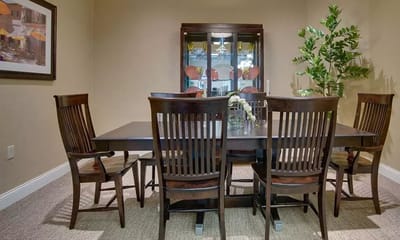 Dining room table set with wooden chairs
