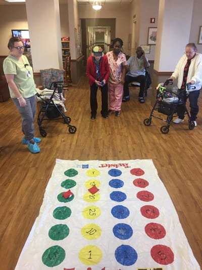 Residents participating in a game in a common area