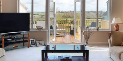 Inviting living room with outdoor access and scenic views