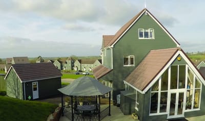 Exterior view of a residential building with a gazebo