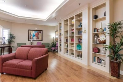 Interior of a common area with seating and bookshelves