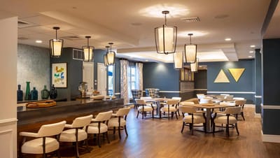 Bright common area with tables and chairs