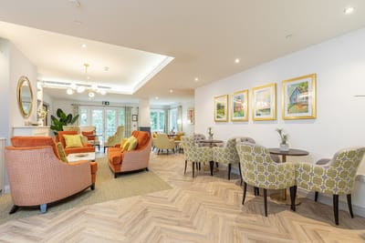 Bright common area with comfortable seating and artwork