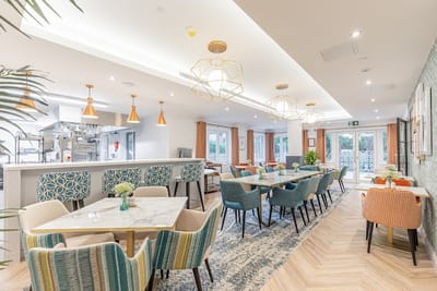 Bright dining area with modern decor and seating