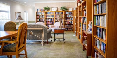 Cozy library area with bookshelves and seating
