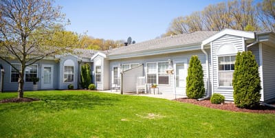 Building exterior of Woodland Terrace with landscaped lawn
