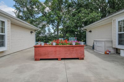 Outdoor patio area with colorful flowers
