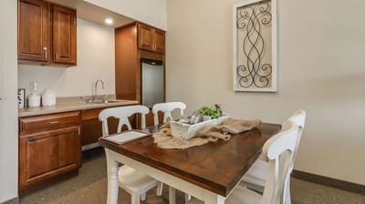Cozy dining area in a resident unit with a table and chairs