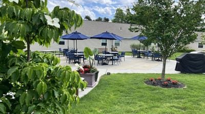 Outdoor patio area with tables and umbrellas