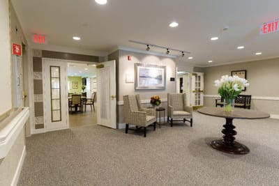 Bright common area with seating and floral decor