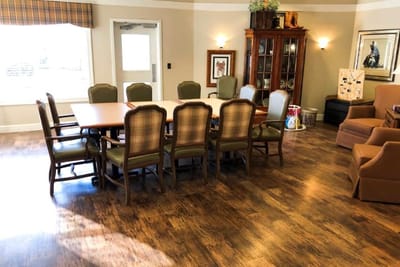 Interior common area with a large dining table and chairs