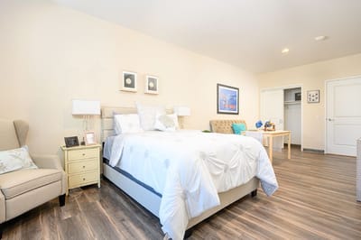 Cozy private resident room with a bed and furnishings