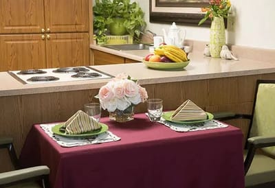 Dining table set for a meal with flowers