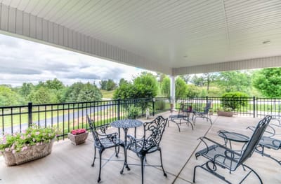 Outdoor seating area with chairs and plants