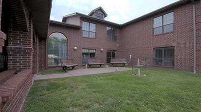 Outdoor space with benches and lawn area