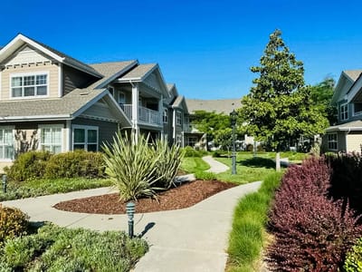 Path through landscaped grounds at a senior living facility
