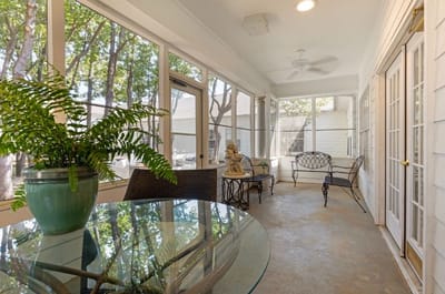 Bright indoor common area with seating and plants