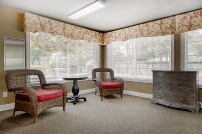 Brightly lit common area with seating and decor
