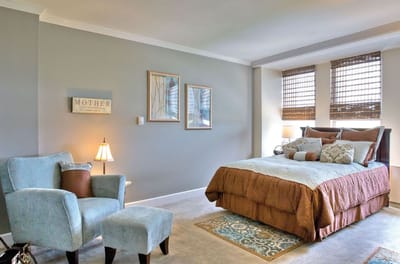 Cozy private resident room with bed and seating area