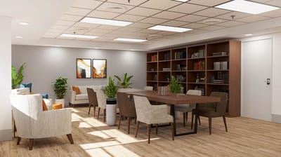 Bright interior common area with tables and seating