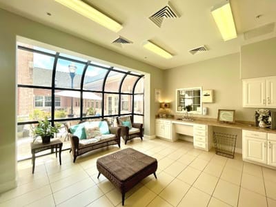 Bright common area with seating and natural light