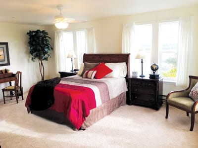 Well-decorated resident bedroom with natural light
