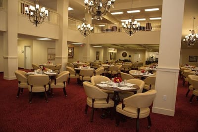 Elegant dining room with round tables and chandeliers