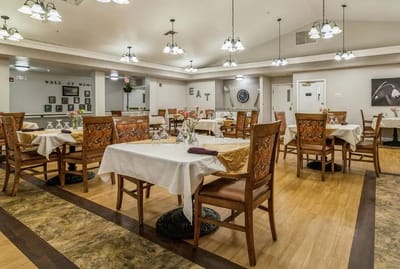 Dining room setup with tables and chairs