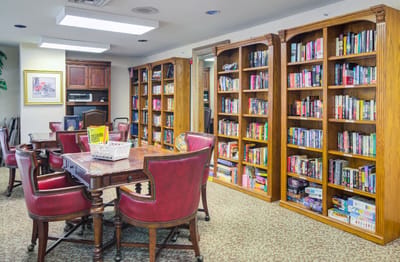 Cozy library area with bookshelves and seating